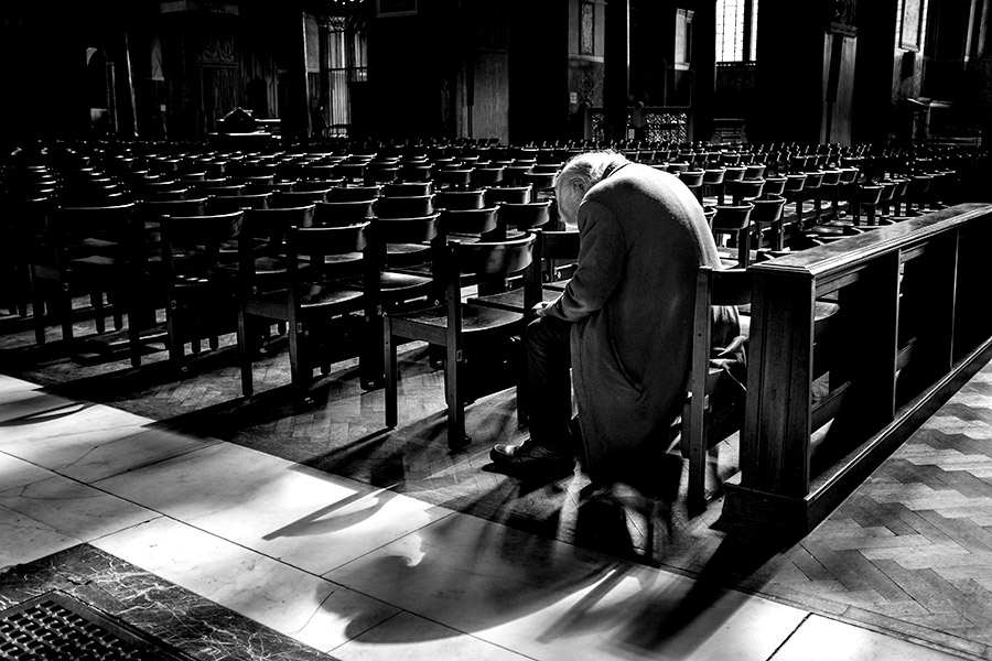 Old man in a cathedral